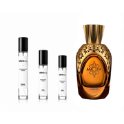 Amora Lumiere Atralia decant sample from The Scent Plug, featuring a clear glass bottle with elegant branding and a silver cap.