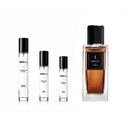 Sample of Babycat Raw Bourbon perfume by Yves Saint Laurent, featuring a sleek bottle with elegant branding.
