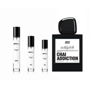 Chai Addiction Rahasya Decant sample bottle by The Scent Plug featuring a sleek, amber-colored container with a minimalist label.