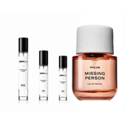 Small sample bottle of Missing Person Phlur perfume decant by The Scent Plug, showcasing the fragrance packaging and branding.