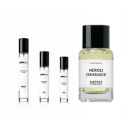 Sample of The Scent Plug Neroli Oranger Matiere Premiere fragrance decant in a small glass vial with a white cap.