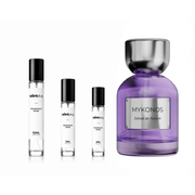 Reflection Elixir Mykonos decant sample bottle from The Scent Plug showing a clear glass container with a minimalist label and reflective design.
