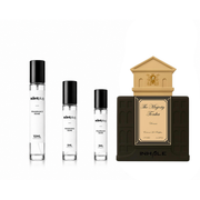 The Scent Plug Majesty Tonka Inhale decant sample bottle with label and clear cap, showcasing its elegant packaging.