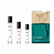 Wadi MAISON ASRAR decant sample from The Scent Plug showing a small glass bottle with a black cap.