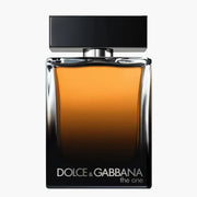 Dolce & Gabbana The One Pour Homme Eau de Parfum spray bottle, 3.4 oz (100ml), with sleek glass design and elegant branding.