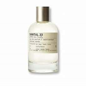 Le Labo Santal 33 Eau De Parfum spray in 3.4 oz bottle, featuring a sleek glass design and signature scent.