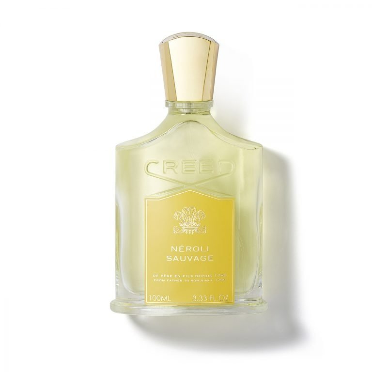 Creed Neroli Sauvage Eau De Parfum bottle with clear glass and white label, showcasing elegant branding and fragrance details.