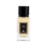 Scentido Toxic Amber Extrait spray bottle with amber-colored liquid, 3.4 oz (100 ml) scent, in a clear glass spray bottle.