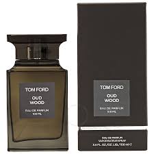 Tom Ford Oud Wood Eau De Parfum spray bottle, 1.7 oz, featuring the luxurious fragrance and elegant packaging.